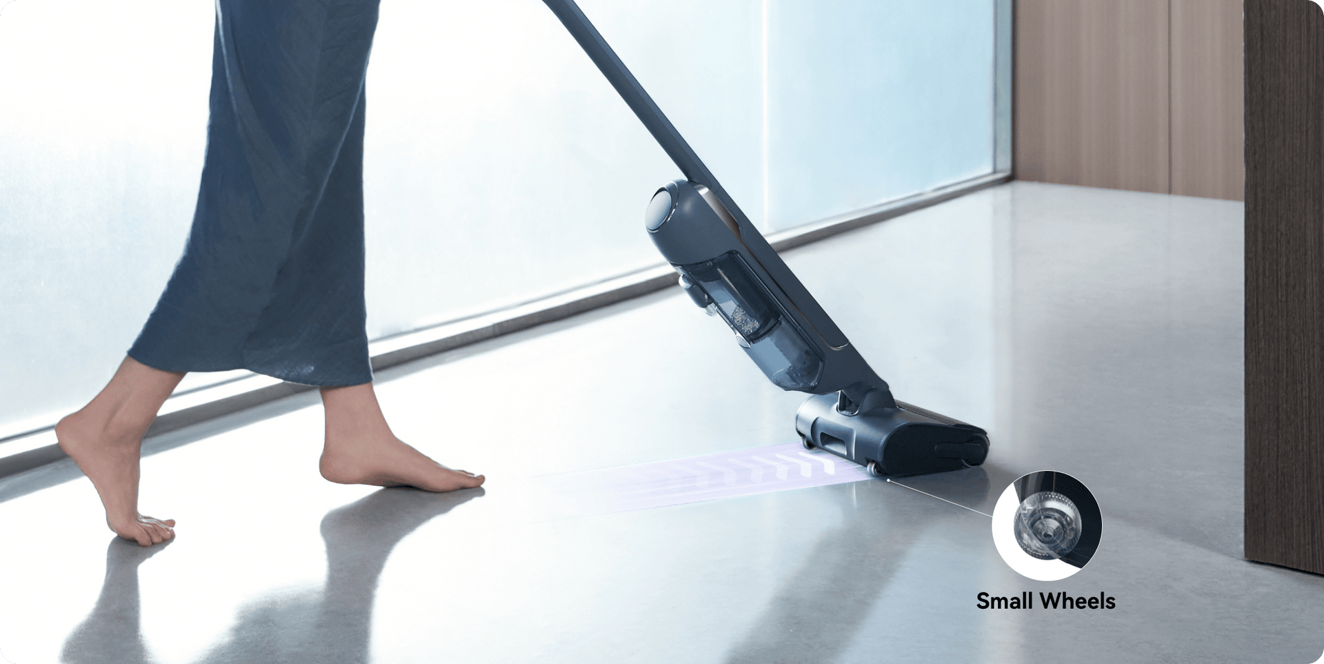 The woman is cleaning the floor with narwal s20pro robot vacuum.