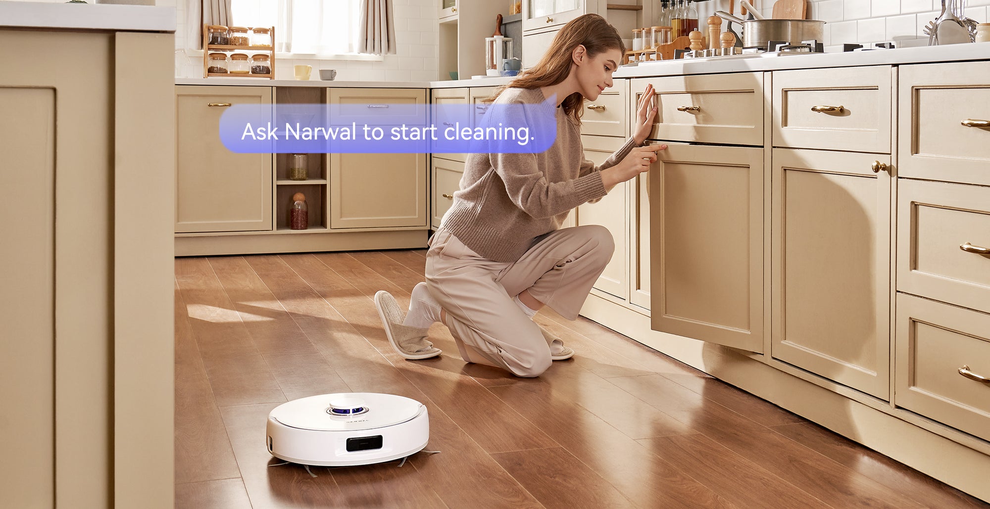 User instructs the Narwal Freo X Plus Robot Vacuum to start cleaning using a voice command while the robot is nearby on the floor.