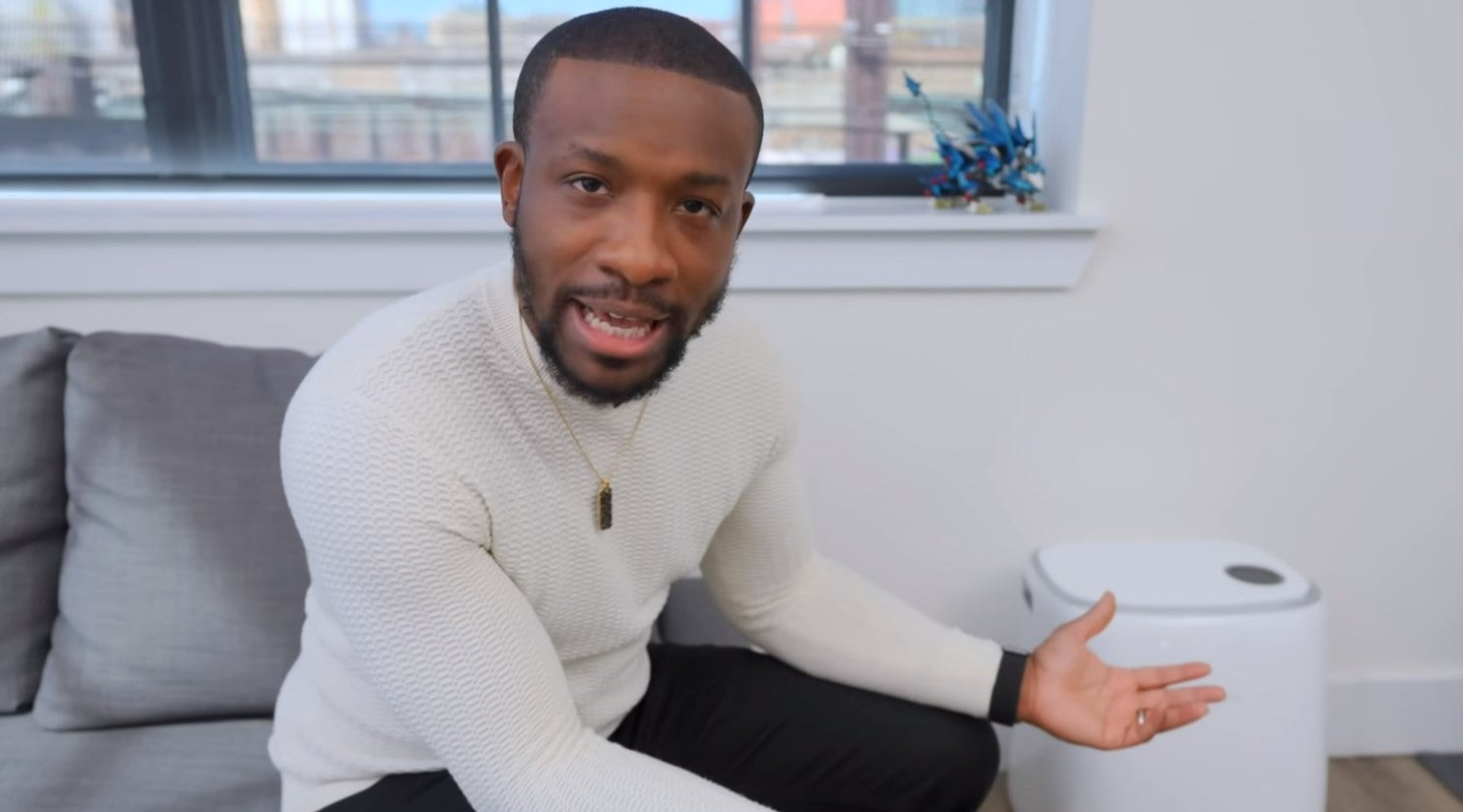 There is a man talking about Narwal robot vacuum.