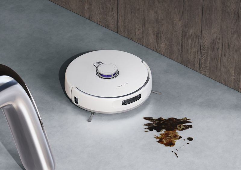 Narwal Freo Z Ultra robot vacuum and mop cleaning a stain on the floor, showcasing its powerful cleaning capabilities.
