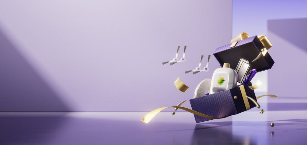 Narwal Freo X Ultra in a gift box with accessories like cleaning tools and ribbons floating around.